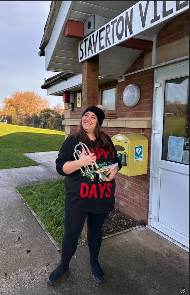 A member of the Otter Homecare team with a cornet at the Otter Café, Staverton Village Hall